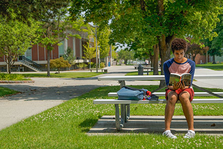 Student reading outside at SFCC
